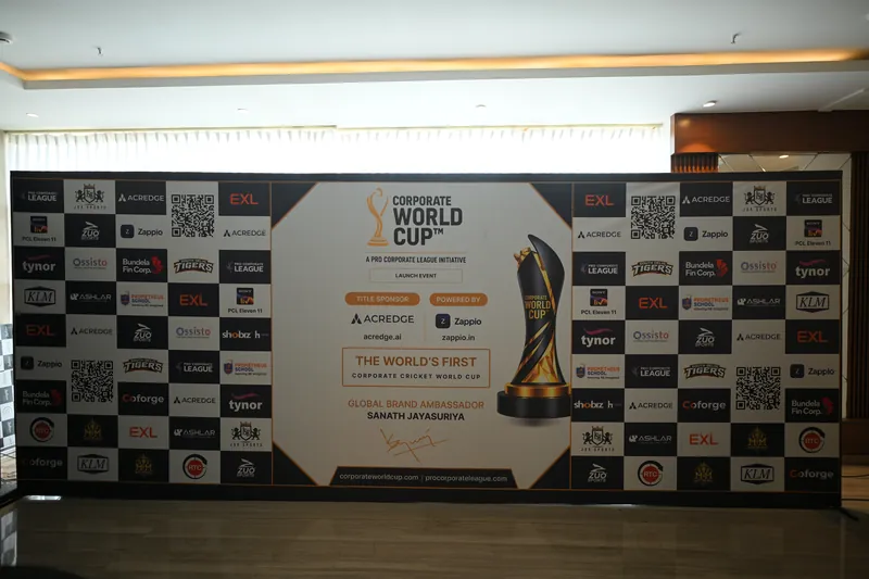 Corporate World Cup launch event backdrop showing title sponsor Acredge and powered by Zappio, with partner logos