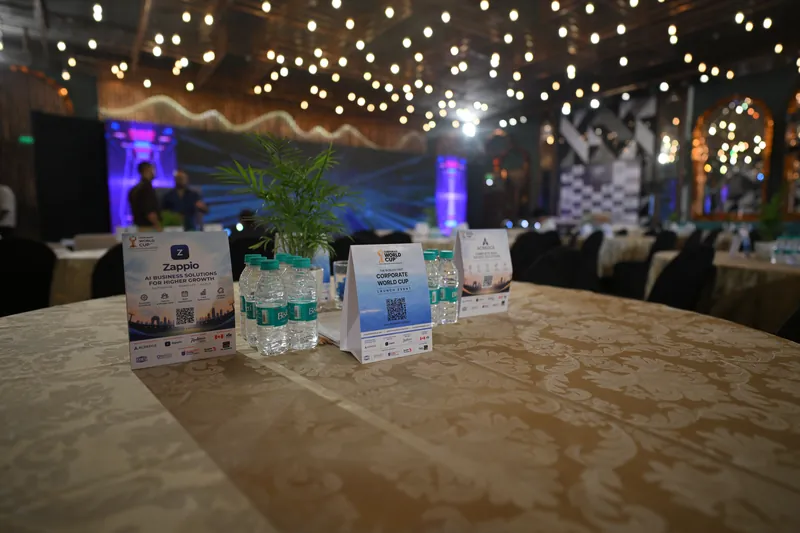 Zappio and Corporate World Cup table cards on guest tables at the launch evening